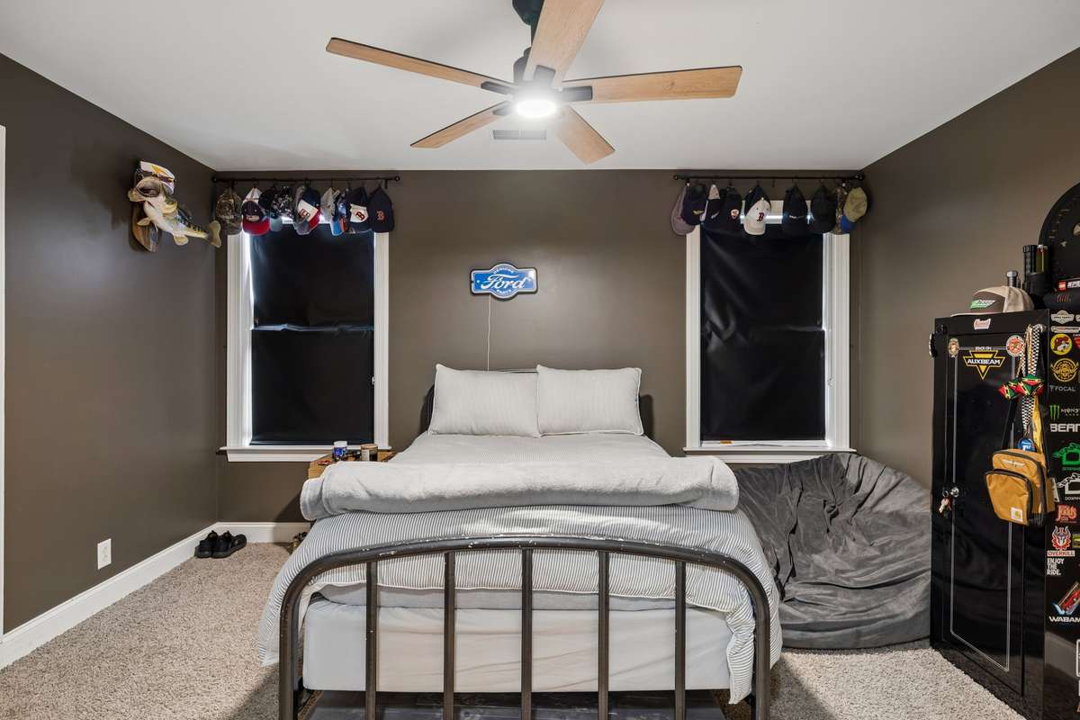 Another secondary bedroom with ceiling fan