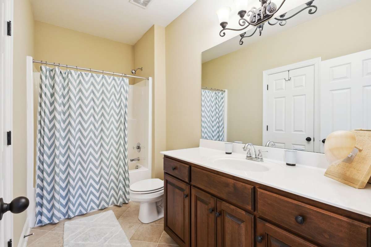 Second full bathroom. Can be accessed from the hallway or directly through adjoining Bedroom 4