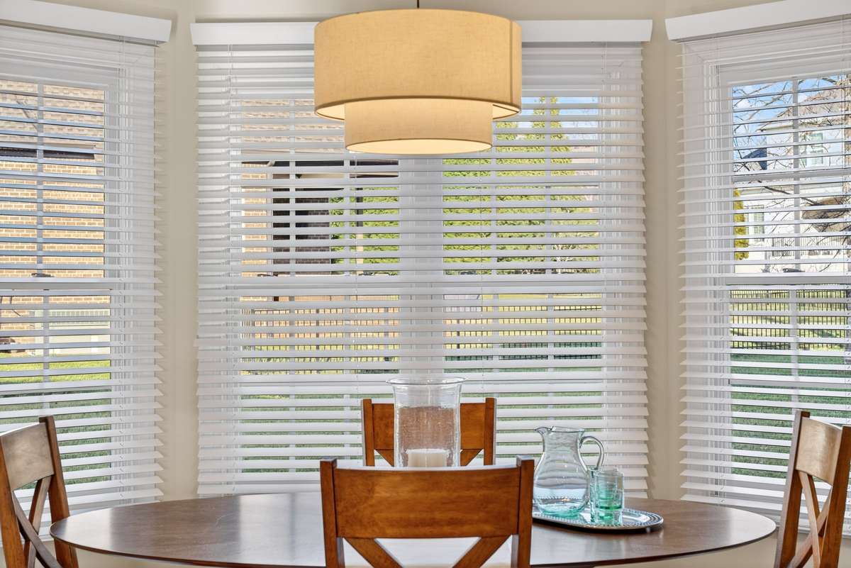 Motorized remote-controlled blinds in the kitchen for effortless privacy or letting in the sunshine without any fingerprints