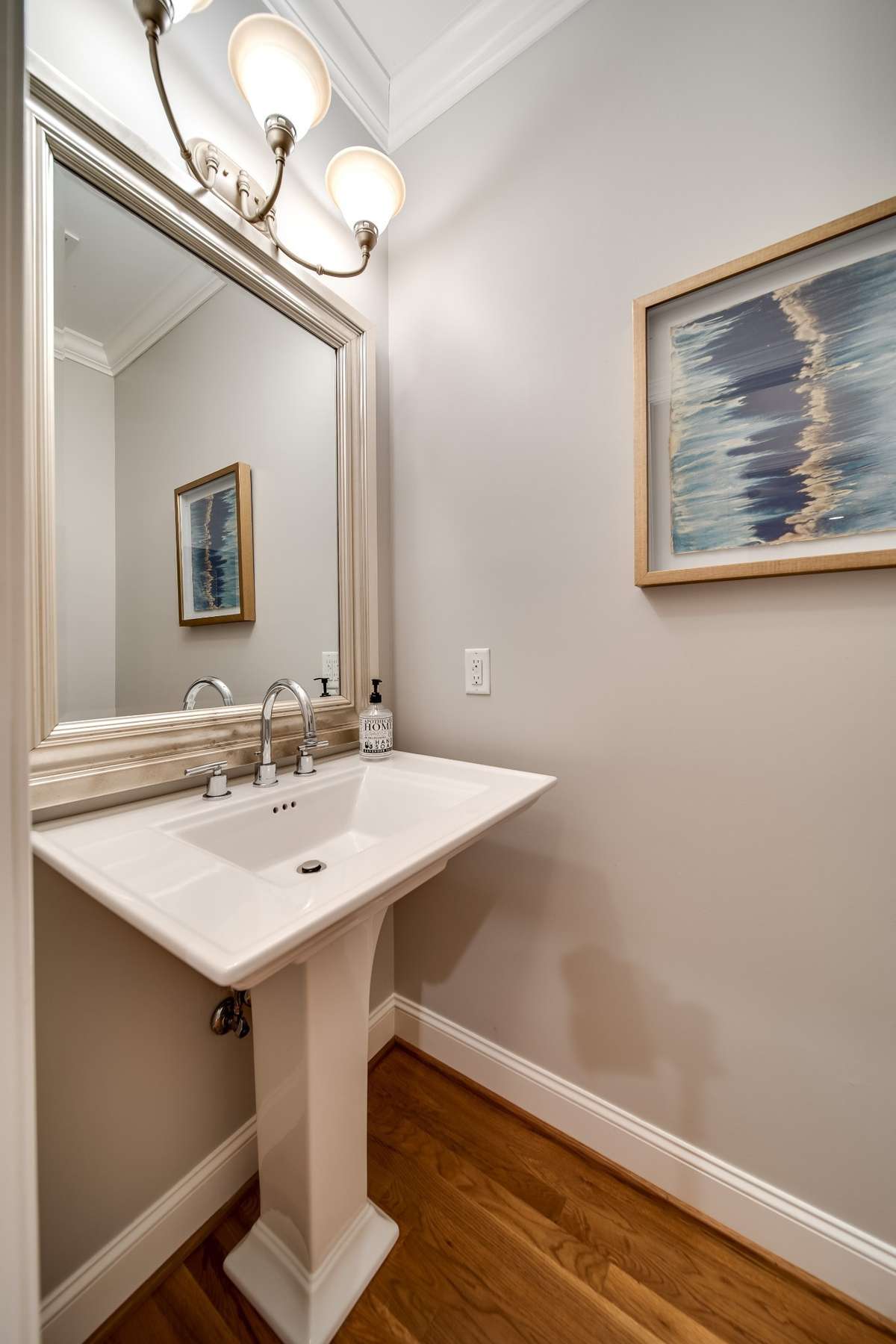 First half bath is separated from the living room in a separate alcove