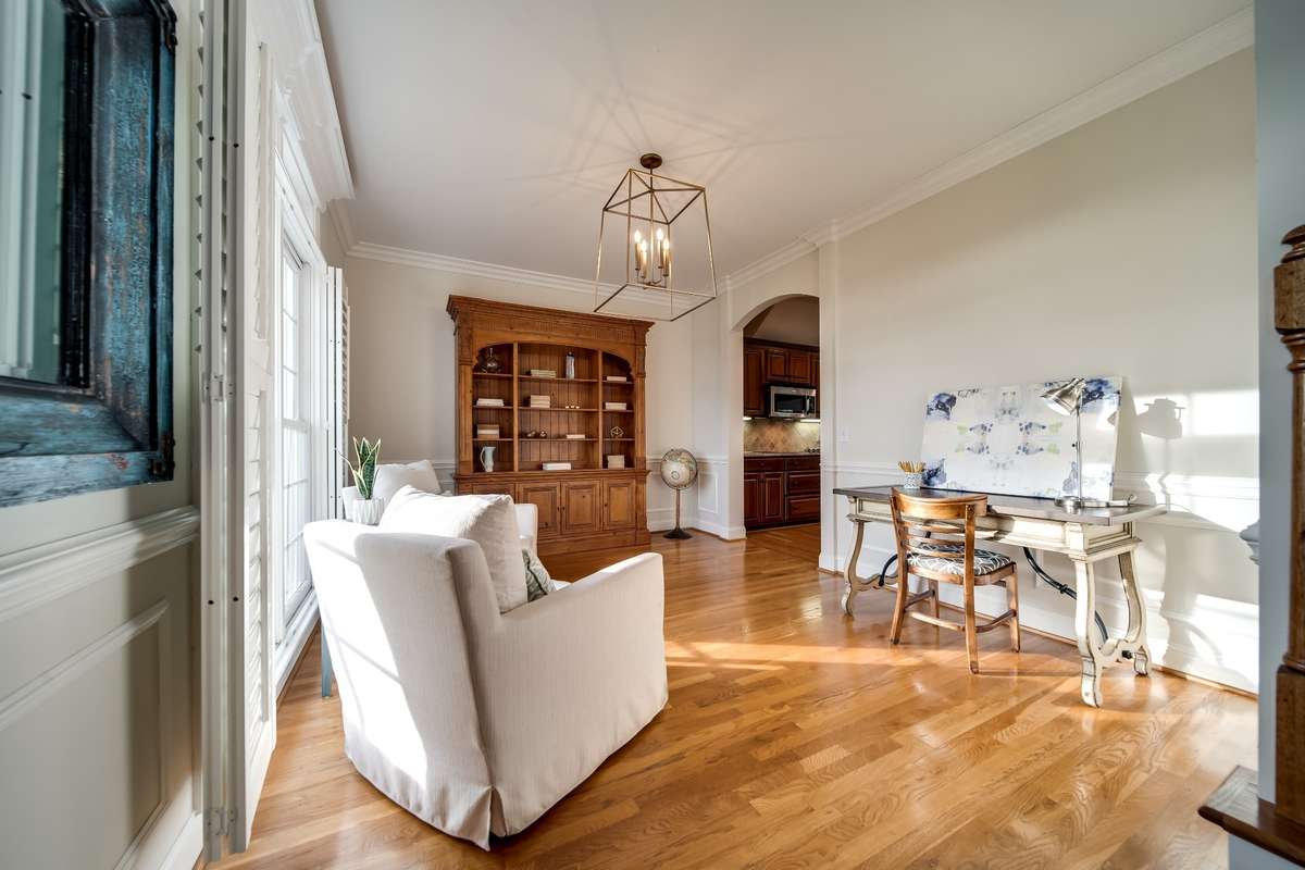 Study or Dining room leads into kitchen, appointed with plantation shutters and millwork along the walls