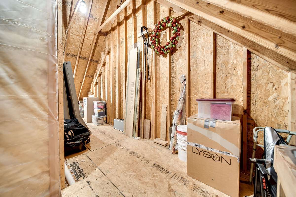 Super tall storage area for hanging off season decorations or additional shelving. Storage room wraps around both sides of the second full bath upstairs
