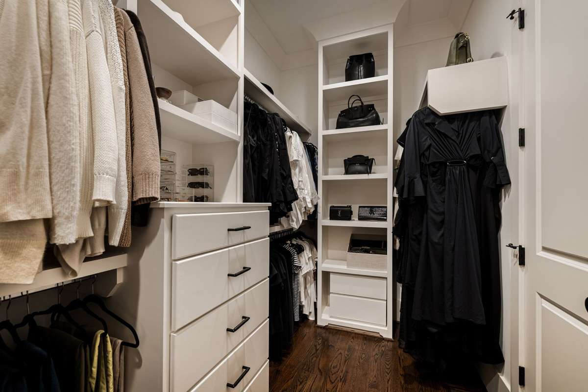 Additional view of walk-in closet with extensive storage and display space