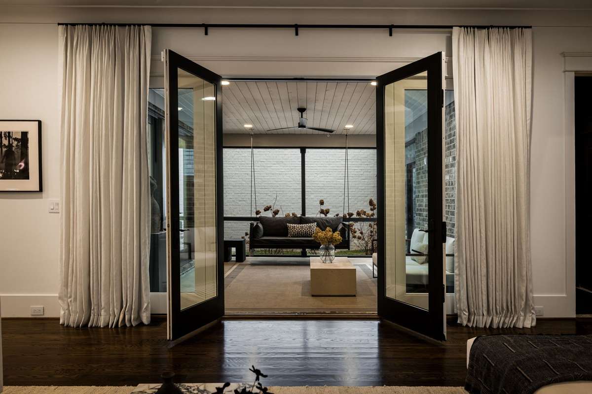 Living room opening to the screened porch