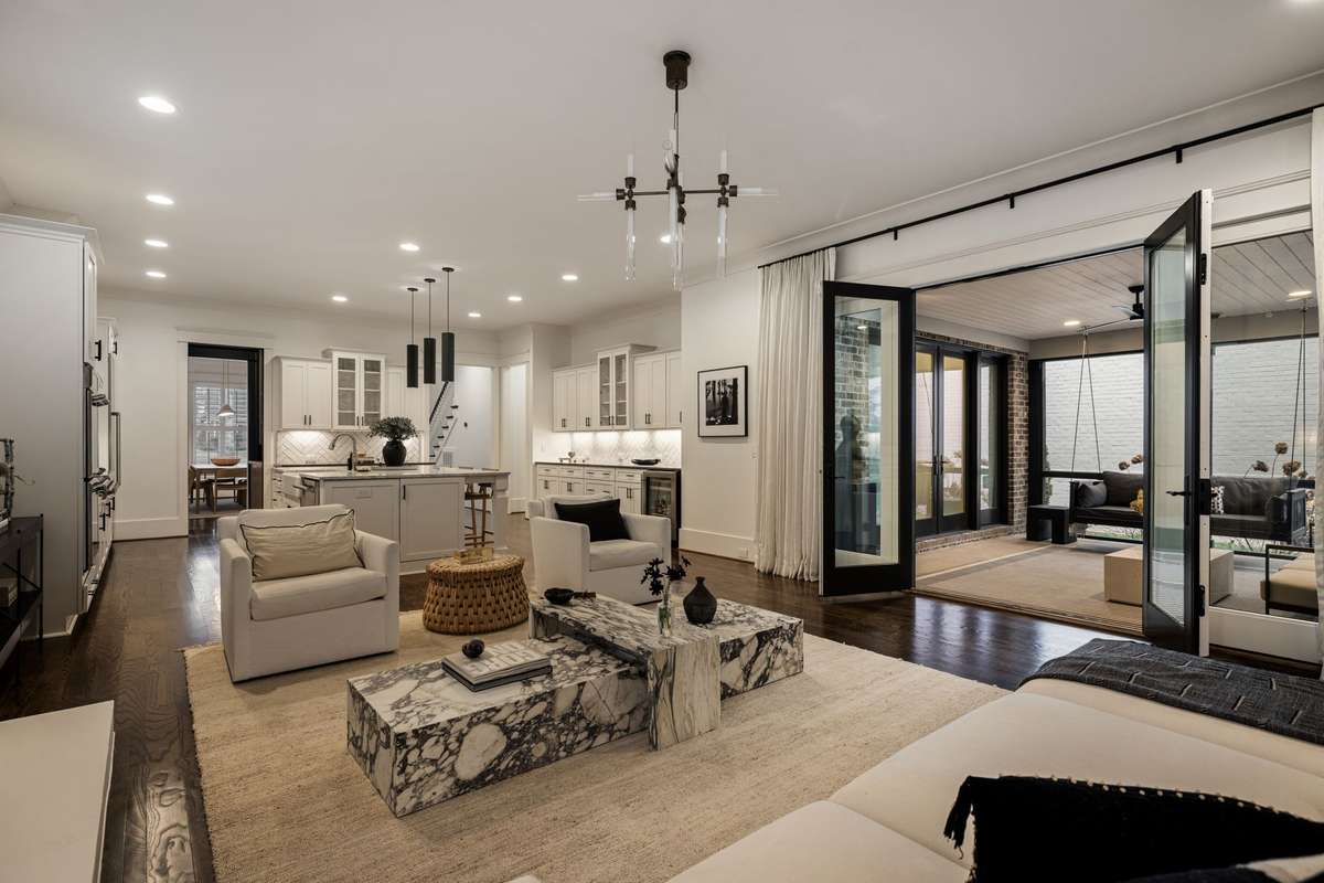 Open-concept living and kitchen with seamless indoor-outdoor connection