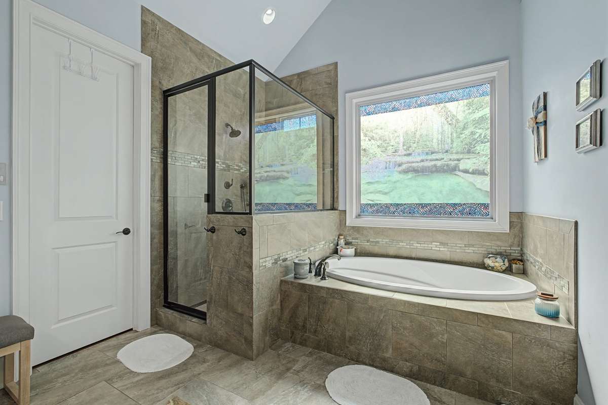 Separate walk-in shower and soaking tub in primary bath