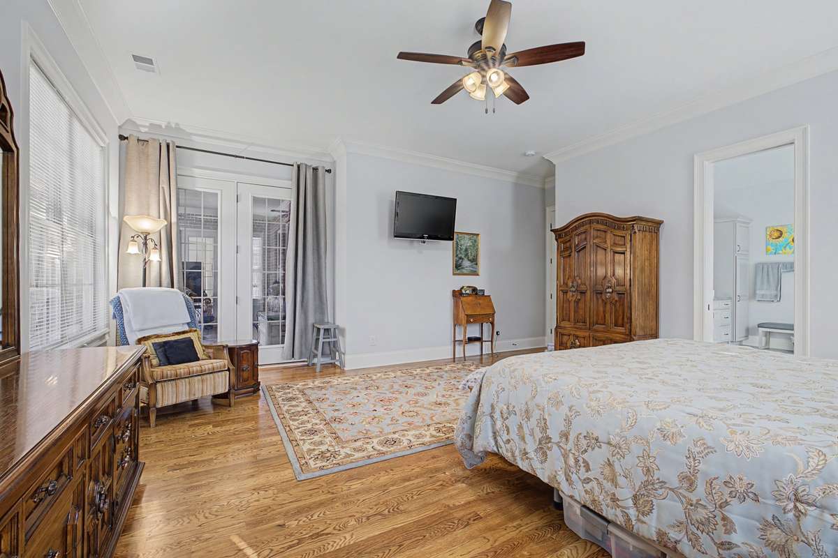 Primary Bedroom with private entry to elevated, screened in deck