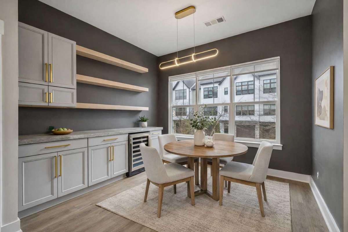 Dining Nook & Stunning Wet Bar with Wine Fridge, Concrete Countertops, Custom Cabinetry & Open Shelving

Photo is virtually staged for marketing purposes
