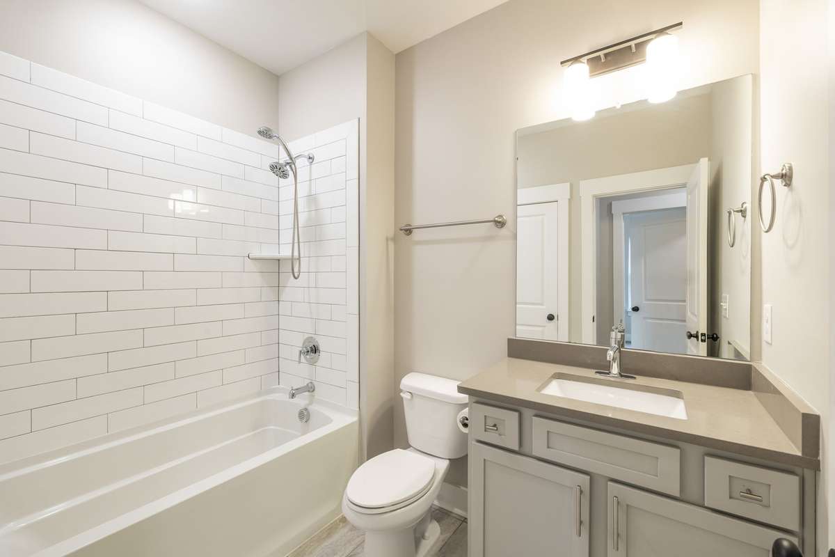 Guest Bathroom on 3rd Level with Linen Closet, Tile Flooring & Shower/Tub Combo with Tile Surround