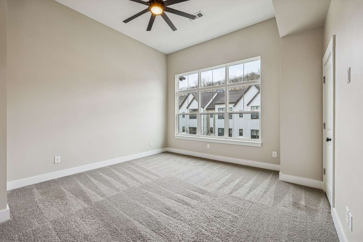 Primary Bedroom with High Ceiling, Ceiling Fan & Large Closet with Built-In Shelving