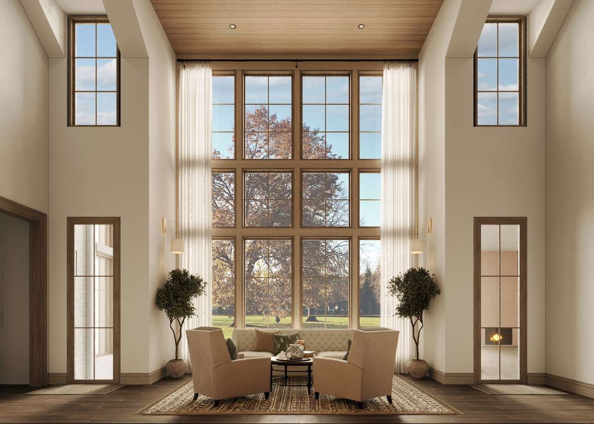 Adjacent to the great room and kitchen, the keeping room features a stunning wall of windows overlooking the outdoor reflection pool, creating an inviting space for conversation and gathering. Two exterior doors lead to the outdoor entertaining area.
