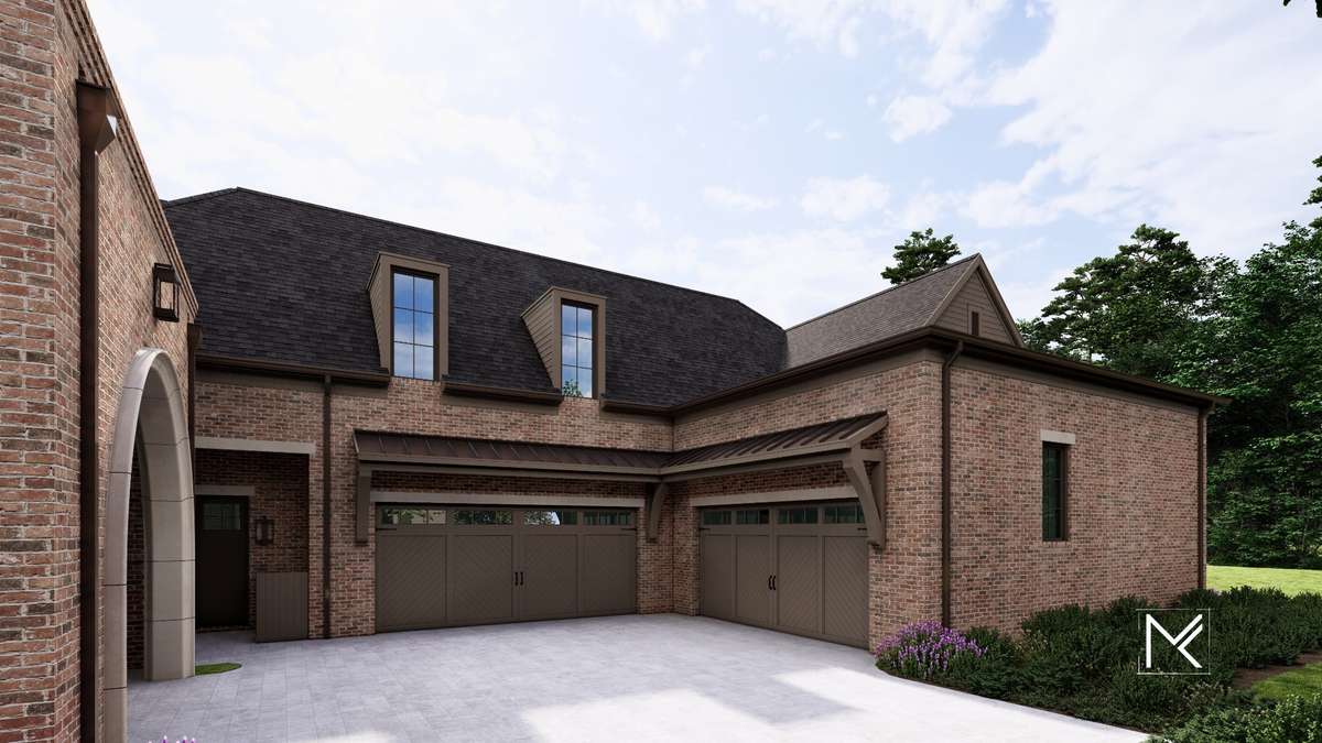 The porte-cochère leads to a defined motor court arrival with a four-car garage.