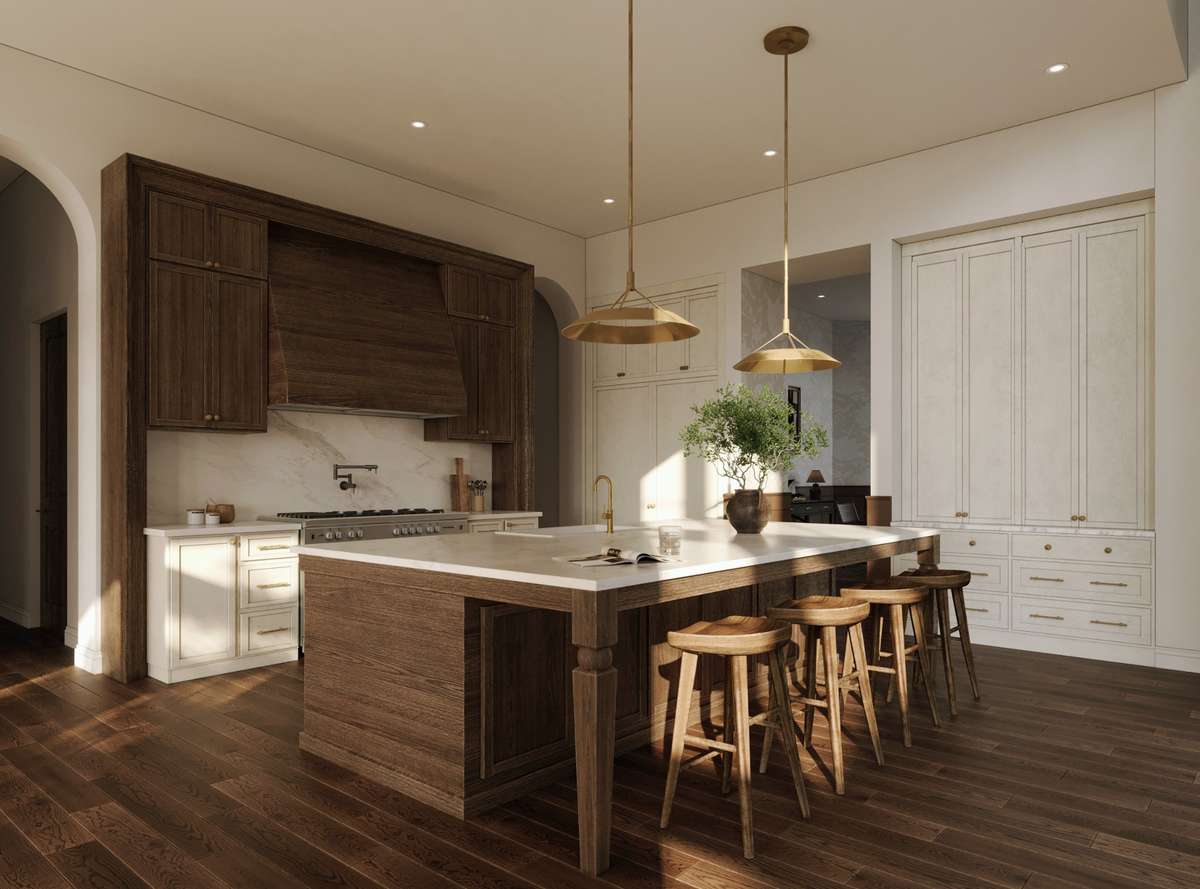 The chef’s kitchen features a large center island with seating, custom cabinetry, panel-ready Monogram appliances, and a dramatic walnut-accented range wall. A separate scullery and walk-in pantry provide additional room for prep and storage.