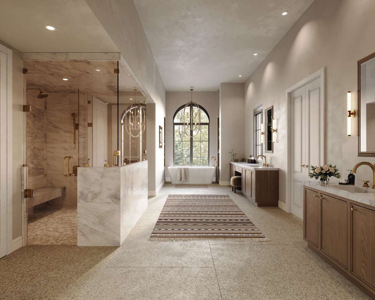 The spa-like primary bath features a glass-enclosed marble steam shower, a freestanding tub beneath an arched window, and dual vanities with custom cabinetry and warm brass fixtures.