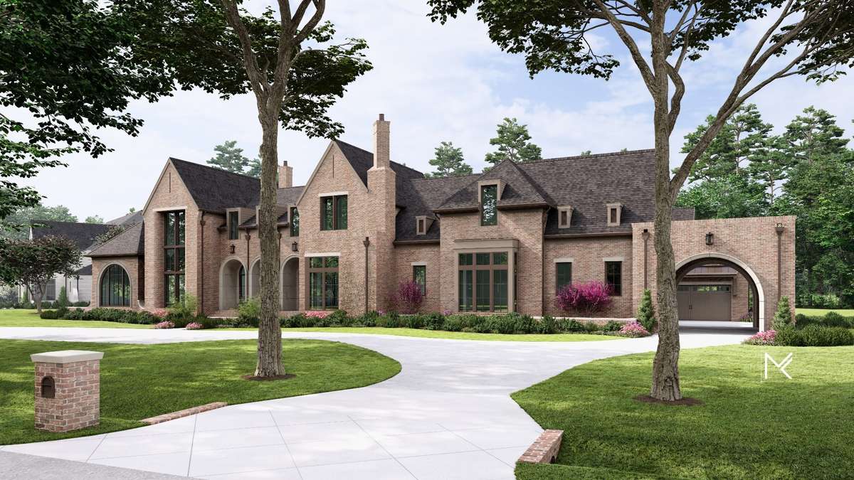 Adorned by mature trees, the circular driveway and porte-cochère create an inviting approach to the home.