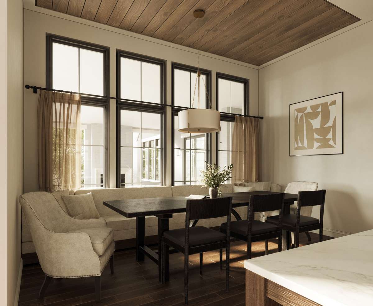 The inviting breakfast nook features a warm wood-paneled ceiling, oversized windows for abundant natural light, and the ideal place for built-in banquette seating, creating a comfortable space for casual dining.