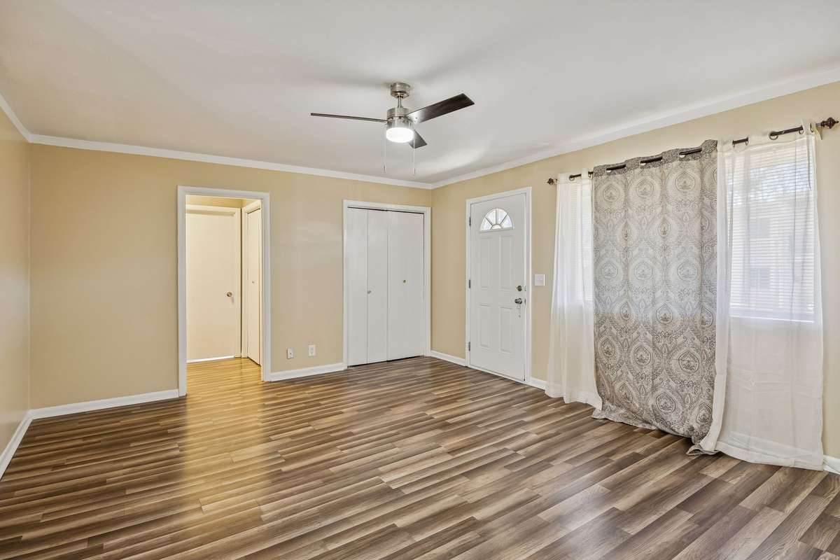 Large living room with solid flooring and storage closet! 550 Harding Place, #F 107, Nashville, TN 37211
