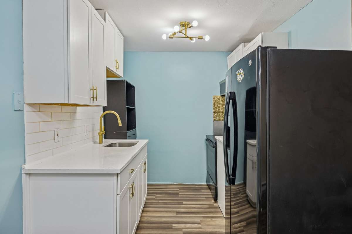 Modern but traditional tiled backsplash and newer lighting throughout! 550 Harding Place, #F 107, Nashville, TN 37211