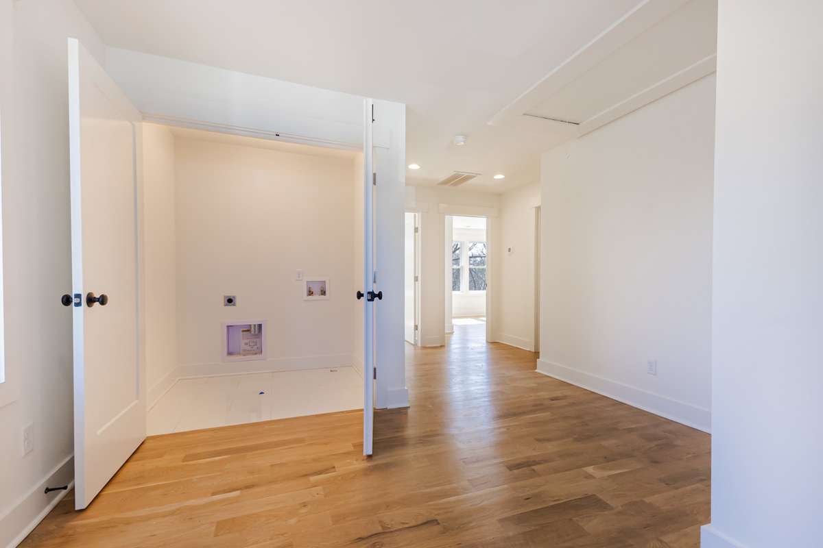 You are now upstairs to and viewing the enclosed laundry room.