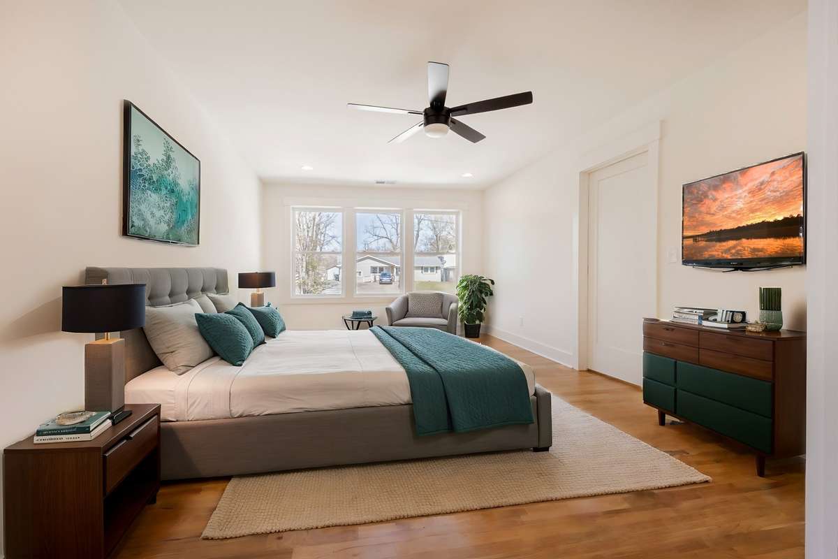 Virtually staged primary bedroom.  Plenty of room for king sized bed and supported furniture.