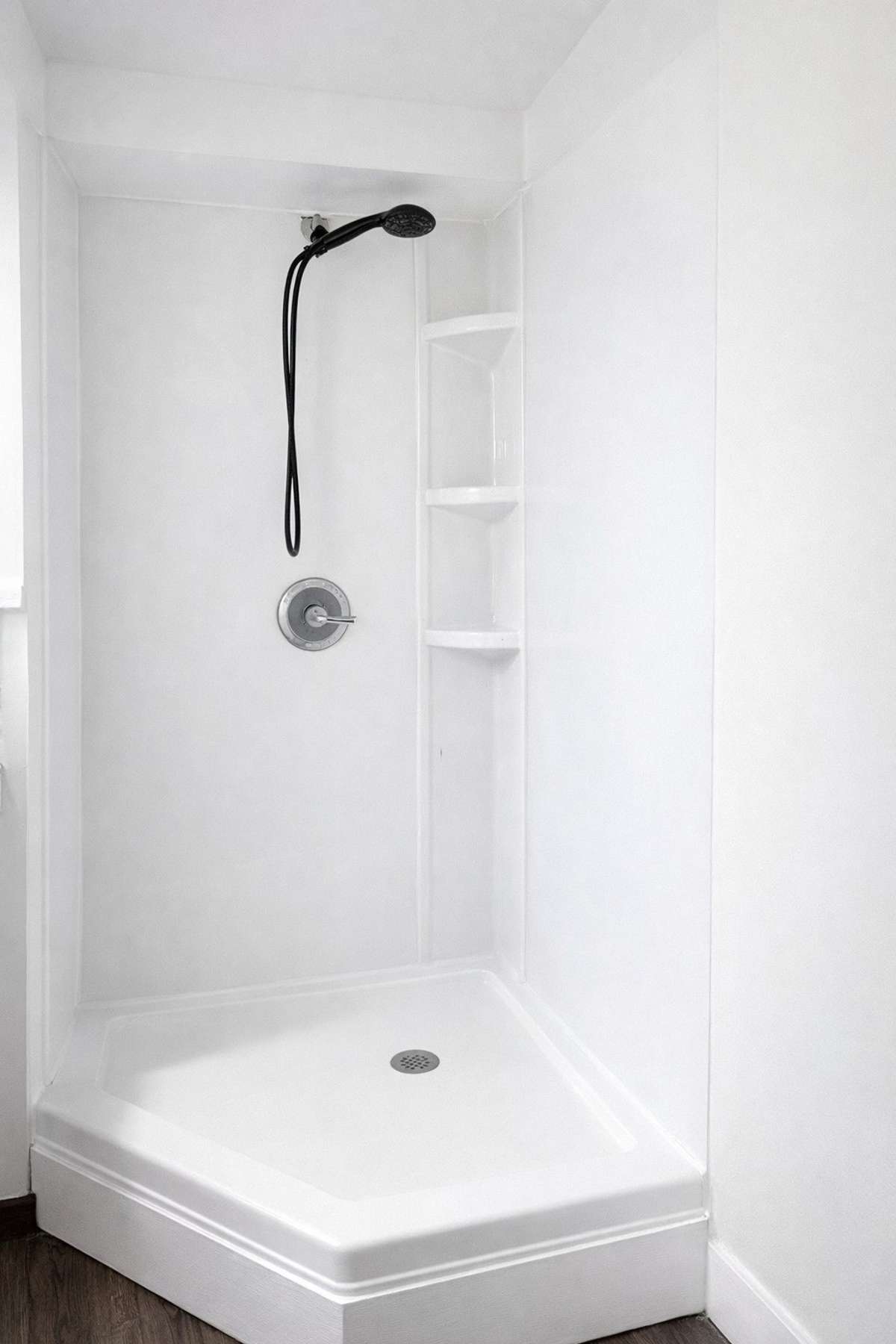 Finished basement full bath with corner shower