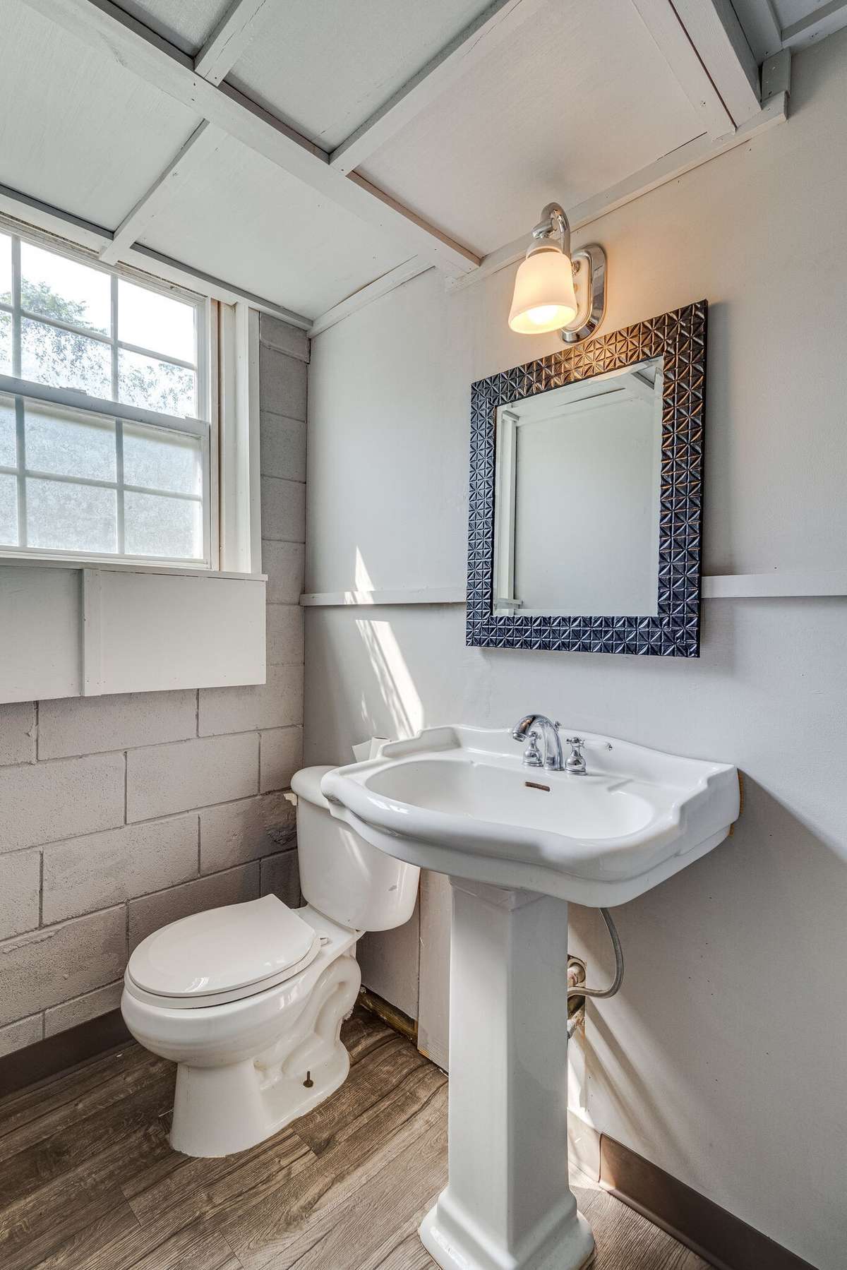 Finished basement bathroom with natural light and functional layout