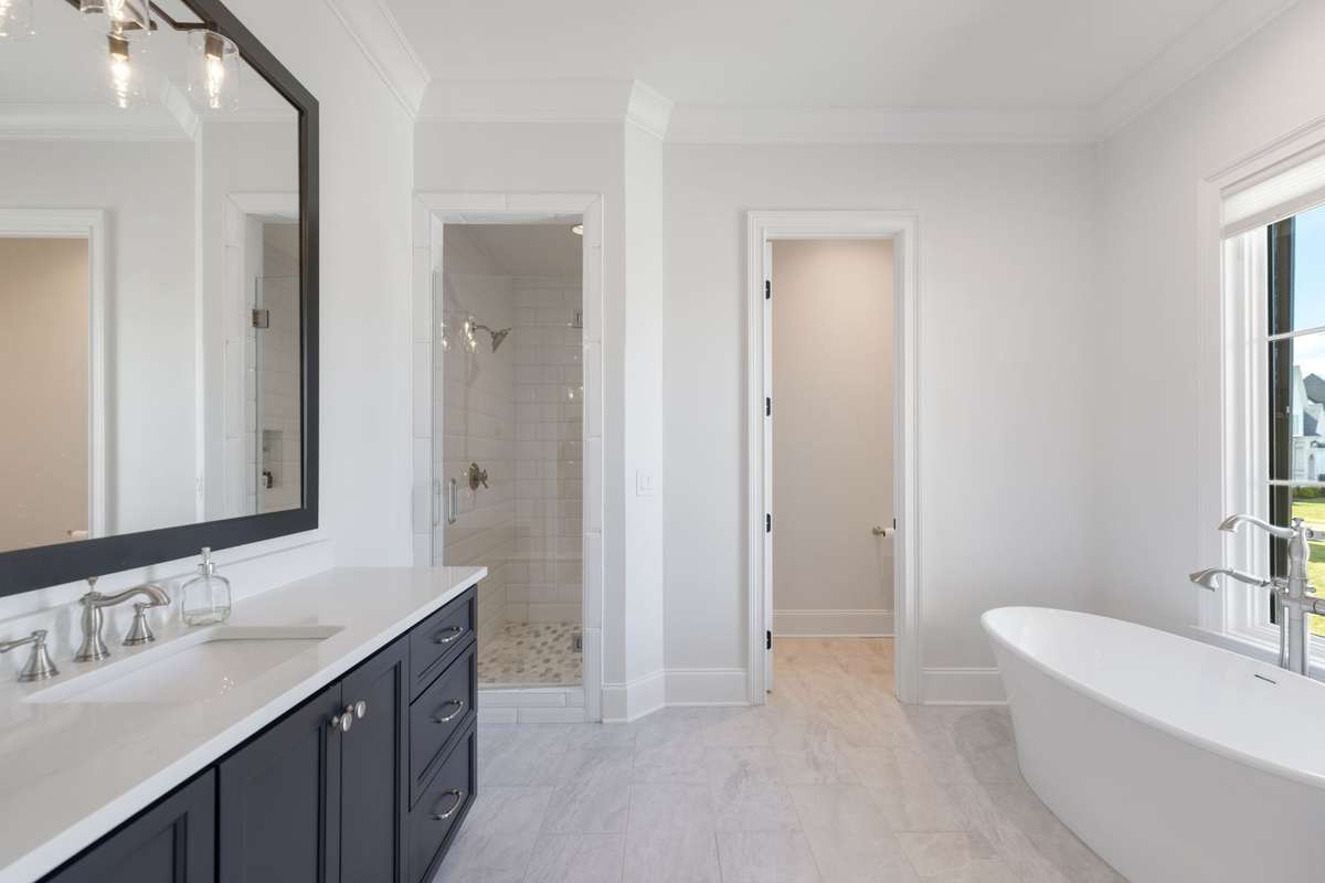 3 secondary bedrooms on the second floor all with attached en suites featuring a walk in shower, separate soaking tub and walk in closets