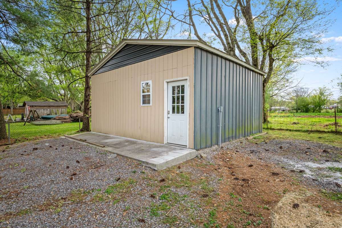 20x22 Shop with new electric and is framed for a garage door.