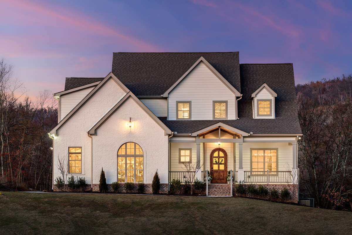 New build on five beautiful acres with crisp brick and hardy siding exterior, arched windows, and a massive covered porch.

*Photo has been virtually edited.
