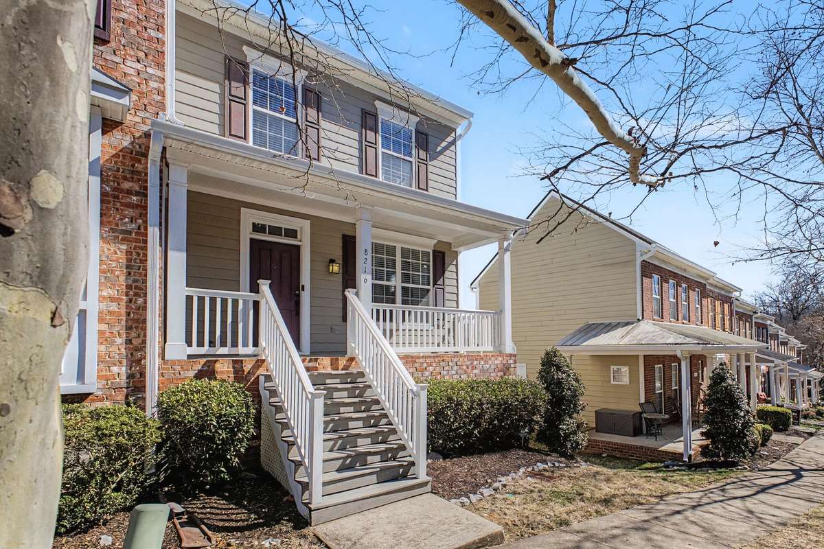 Lovely end unit with room for seating on the front porch.