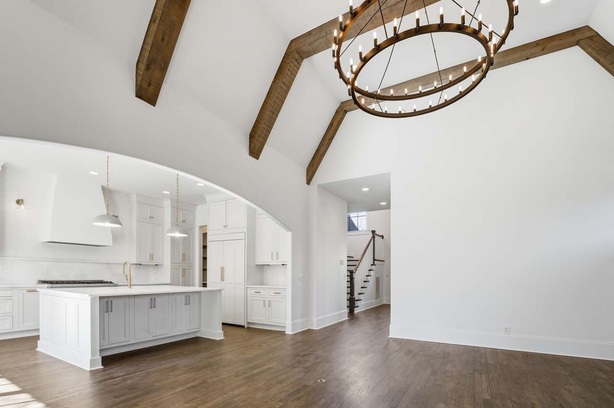 family room view to kitchen and front entry