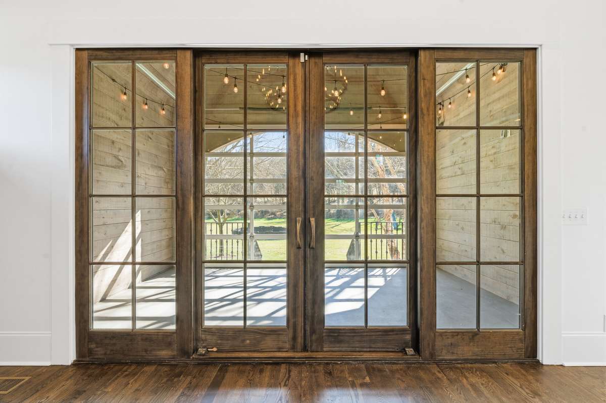view from family room thru porch area to outside
