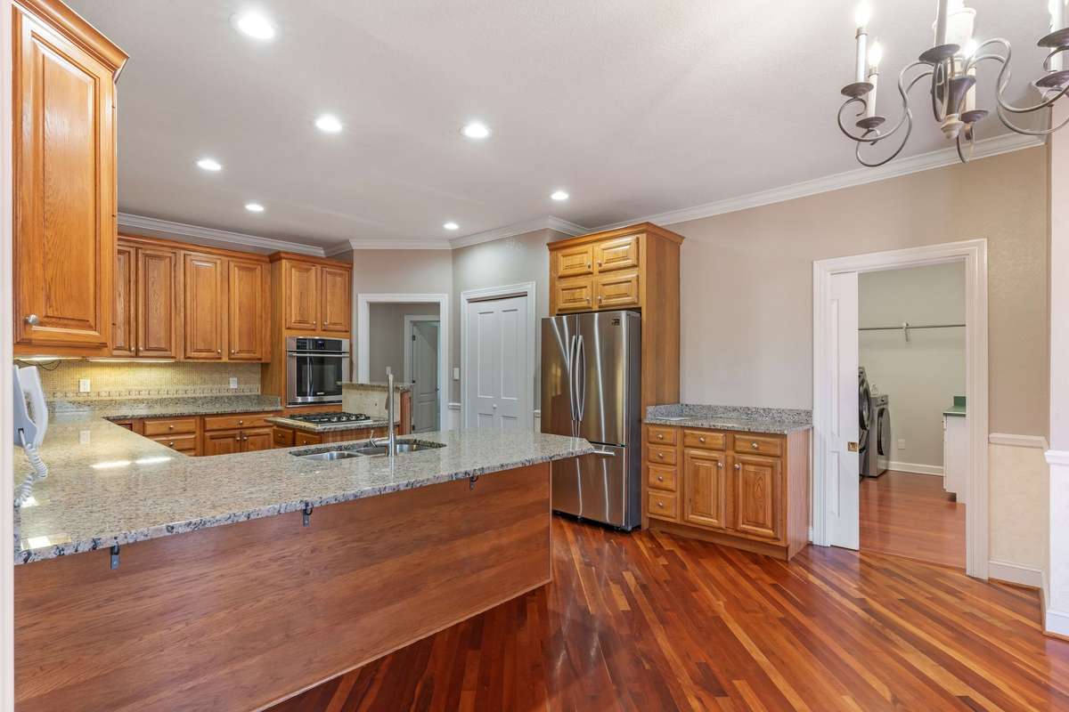 Large eat-in Kitchen with granite countertop and stainless appliances.