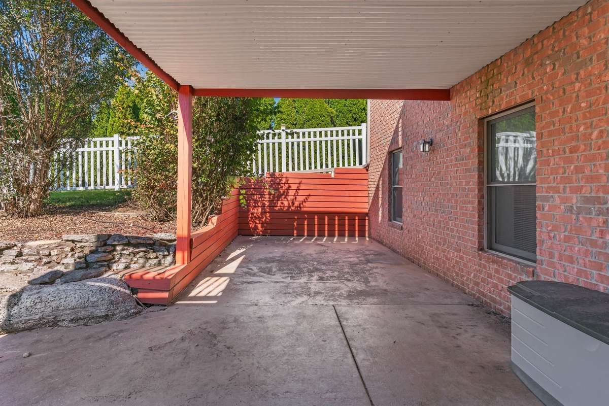 Ground level porch with basement entry.
