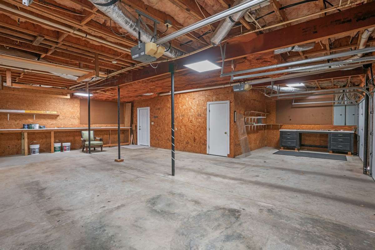 4 car garage with work area.