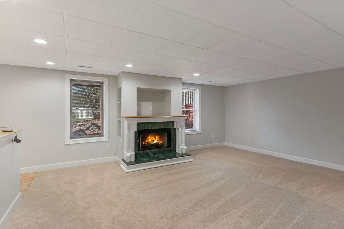 Basement living room with gas fireplace
