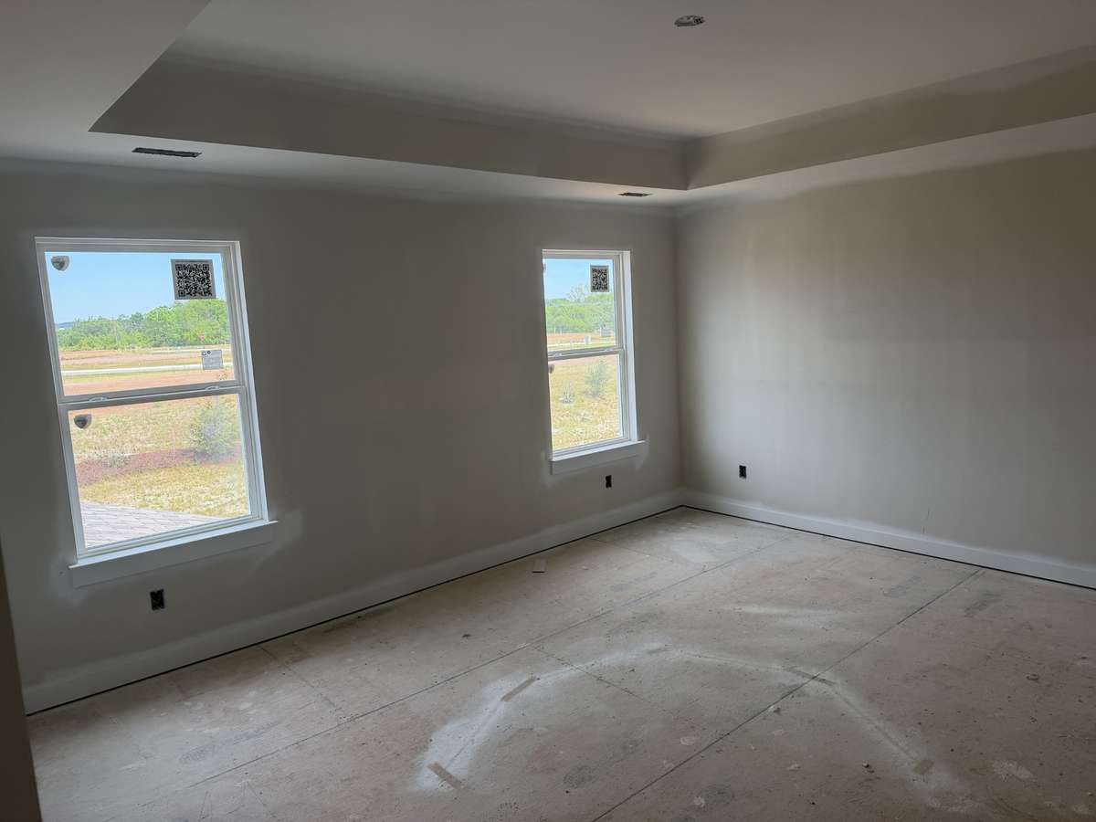 primary suite upstairs with trey ceiling