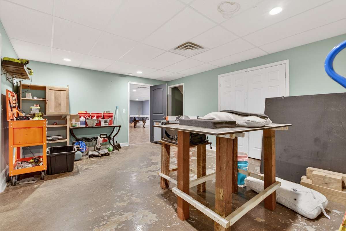 Perfect for hobbyists or extra storage needs — storage space behind the left double doors, plus backyard access with a doggie door on the right.