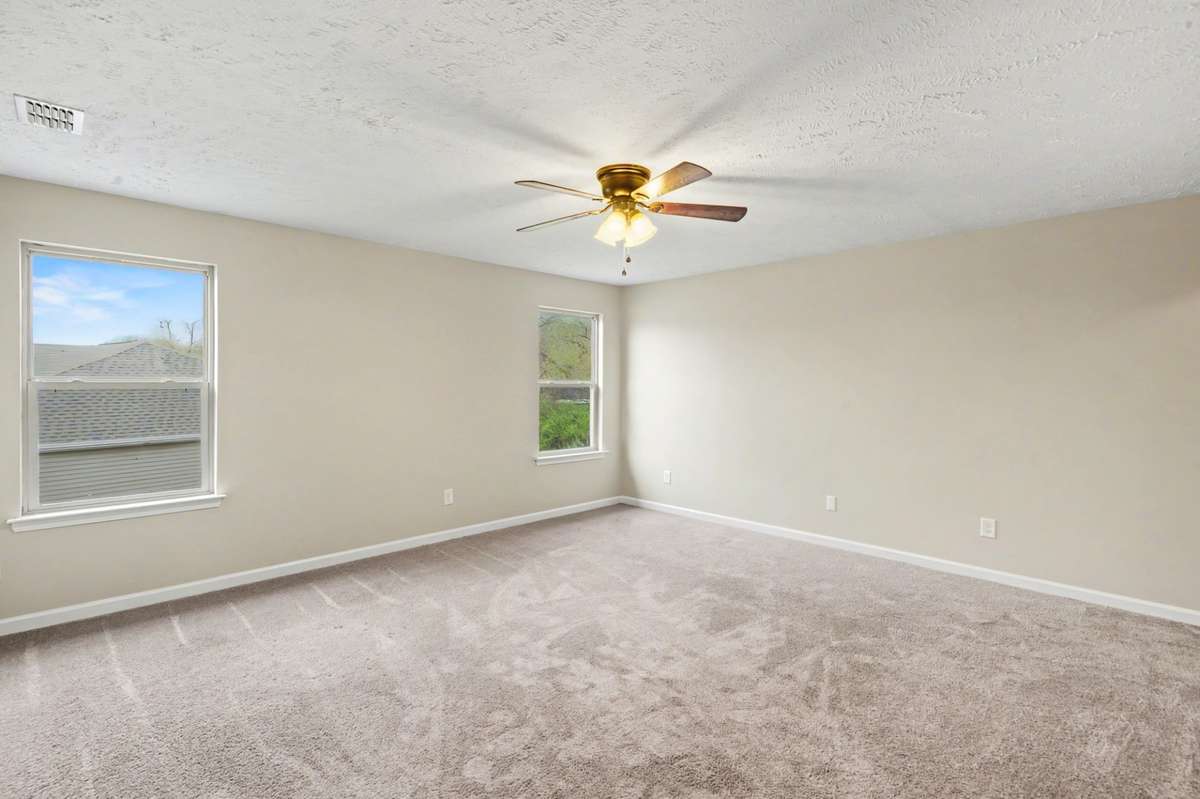 The huge bonus room has an attached bathroom and closet.