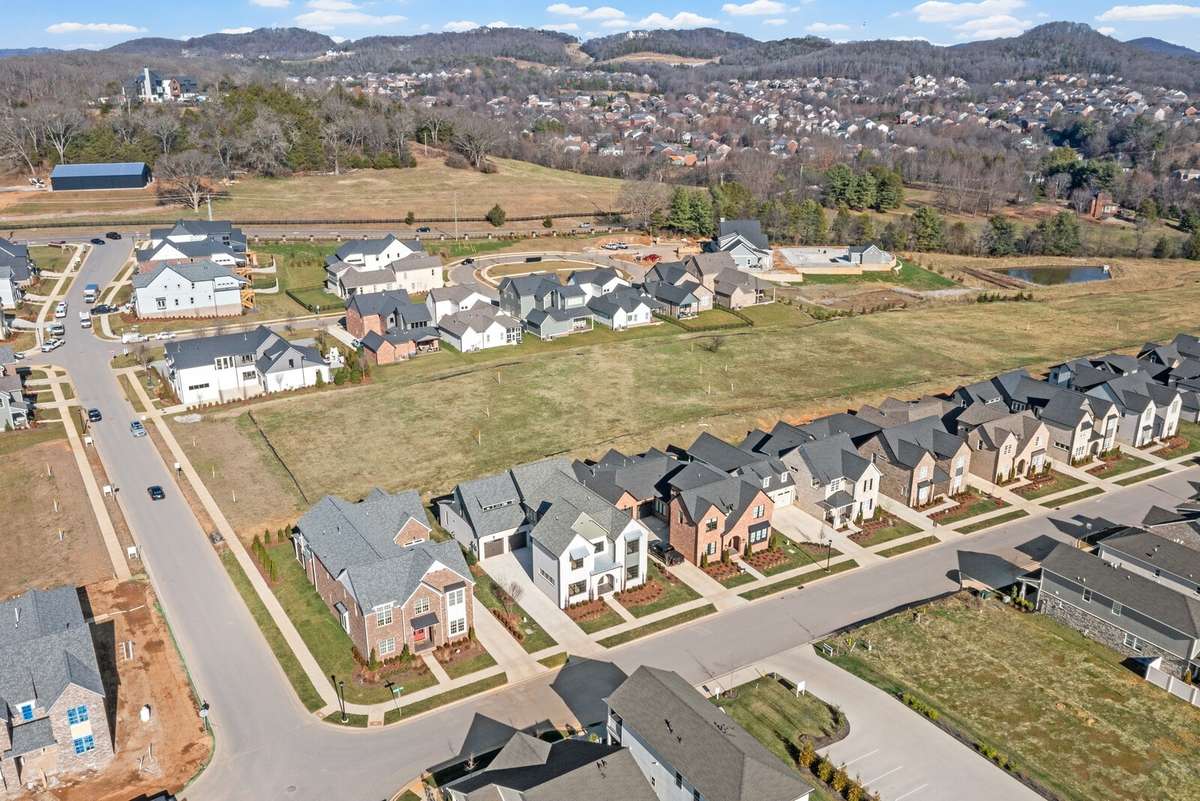 Drone view shows the amenity center, currently under construction (far back corner) with a resort style pool, clubhouse and gym