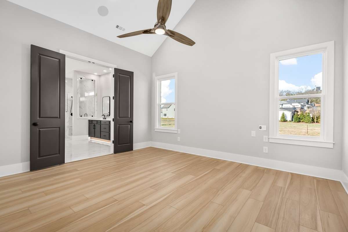 Primary Bedroom with a Vaulted Ceiling