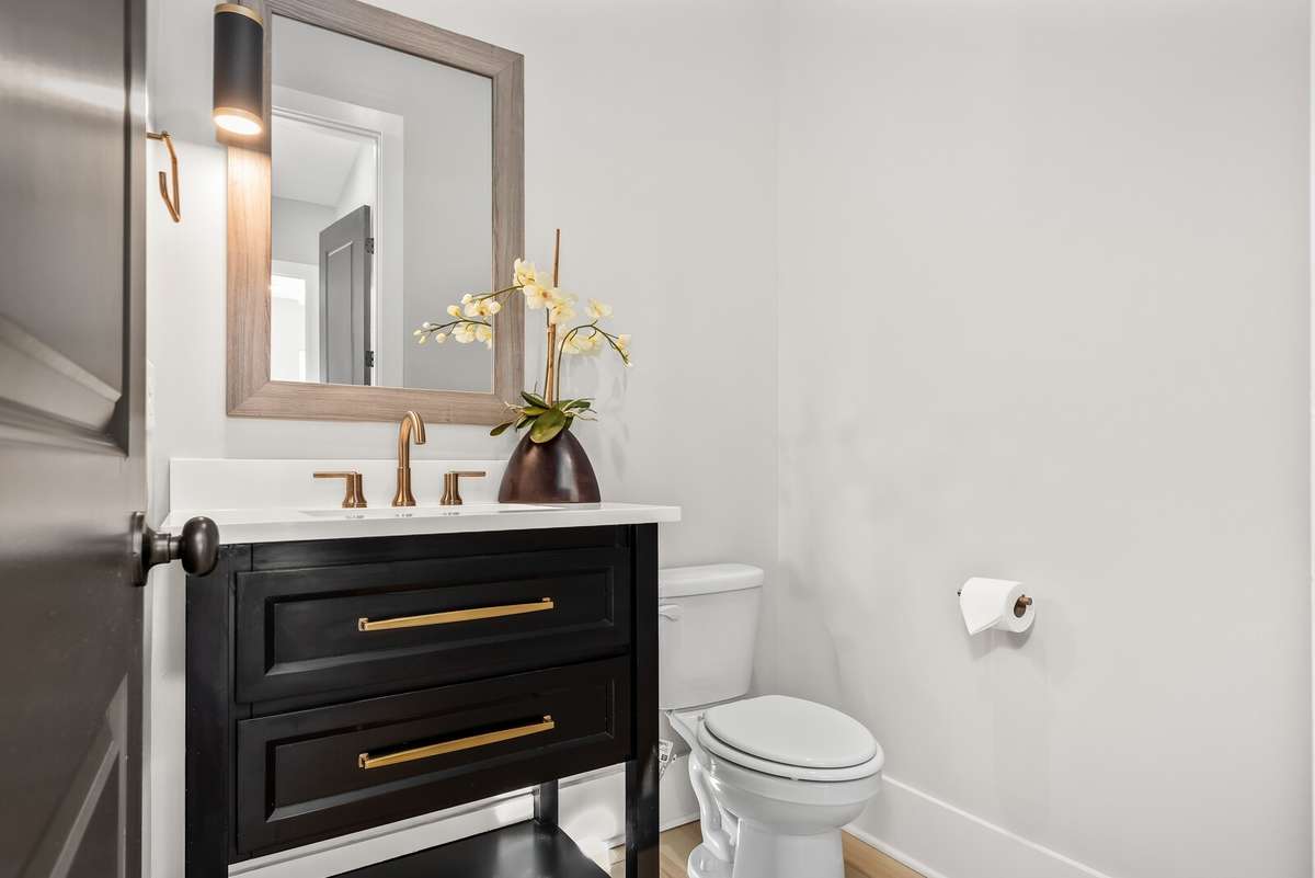 Powder room on the main level - Upgraded Furniture sink allows for storage