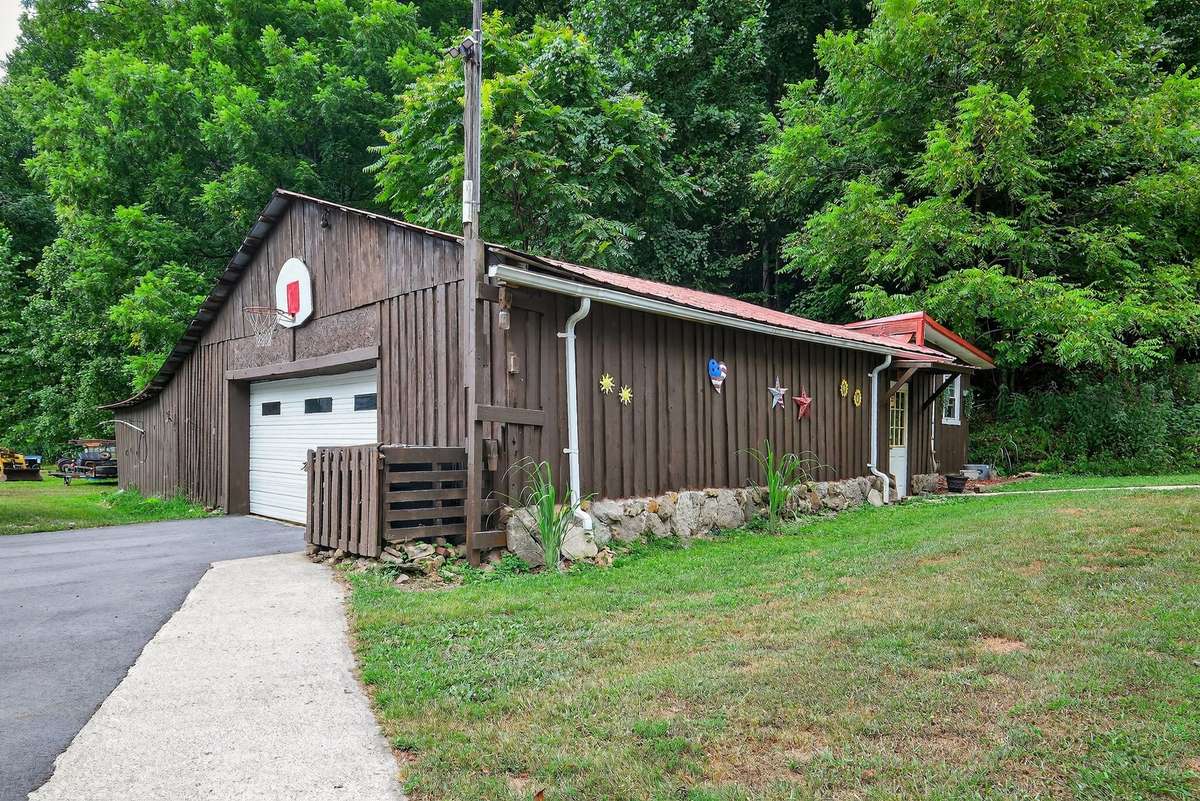 Detached garage with lots of storage.