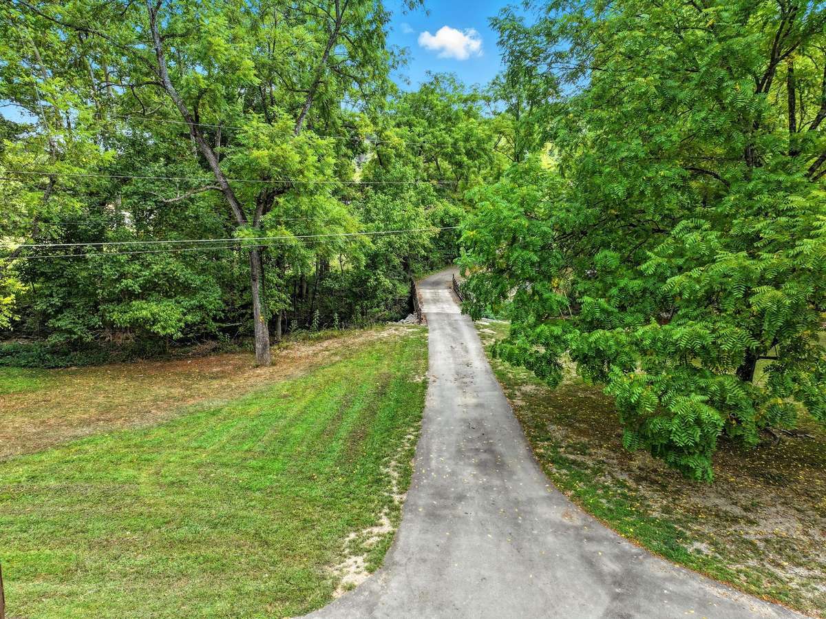This home brings private drive to a new level---conveniently located  but you barely know there's neighbors.