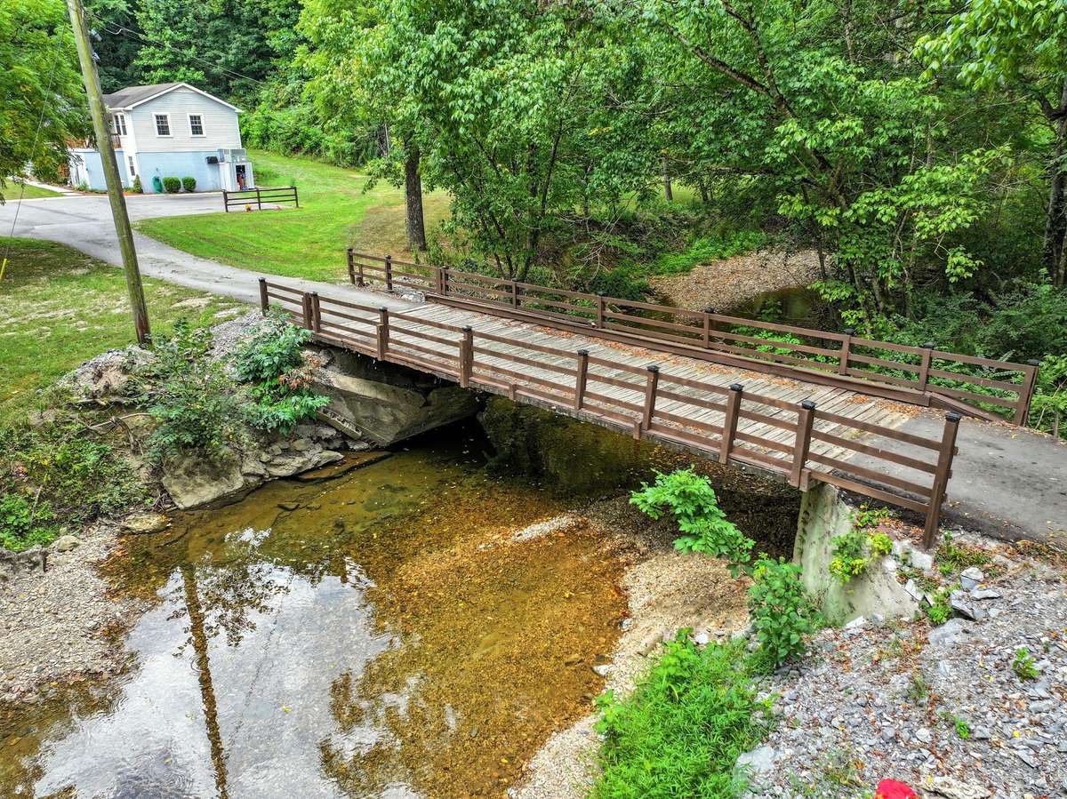 Cross over Drakes Creek to your private oasis.