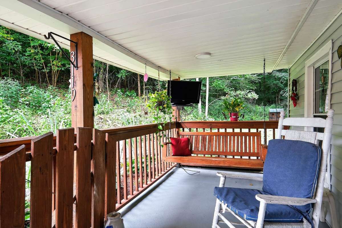 Sit in the shade and swing or rock awhile on the second porch too