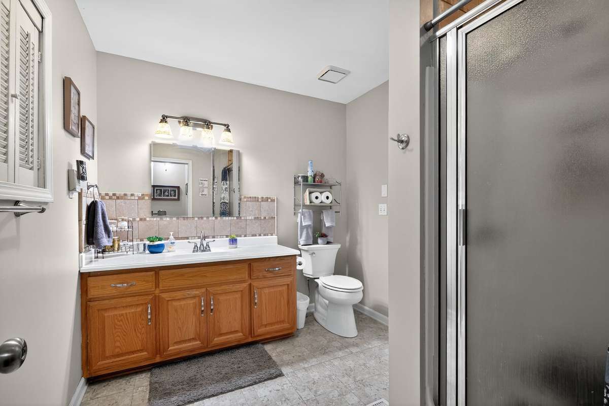 Full bathroom off upstairs bedroom 4 with outside entrance.
