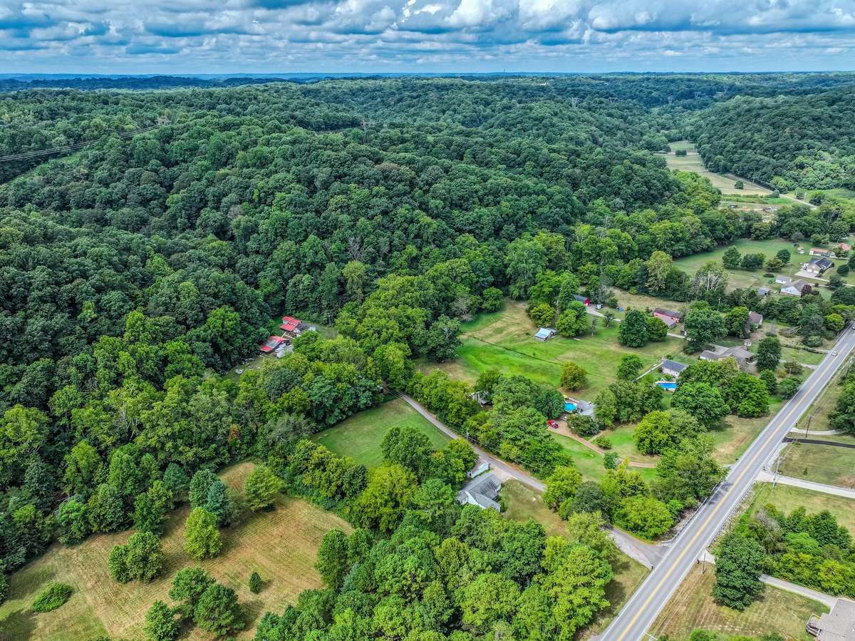 This 9 acre tract in the middle of the woods is the perfect blend of solace and convenience