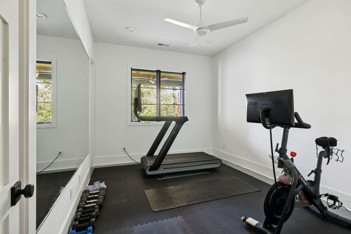 Bedroom five is located in the basement and is currently setup as a gym.
