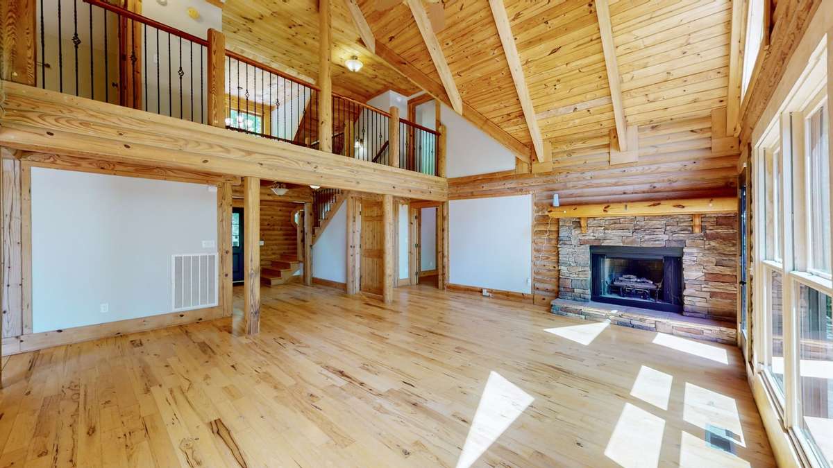High vaulted ceilings connect the upstairs loft and two upper level bedrooms.